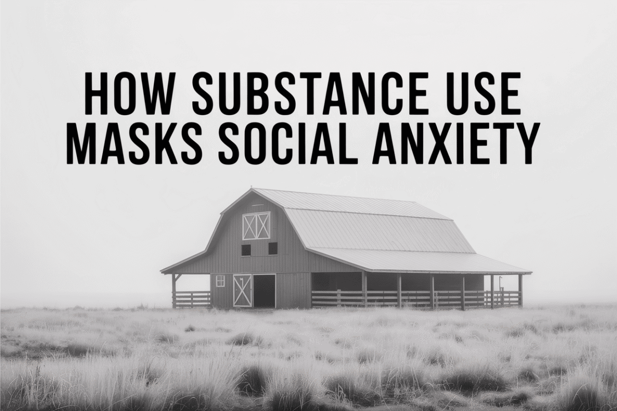 Colorado ranch barn partially obscured by morning fog, representing social anxiety hidden beneath substance use.
