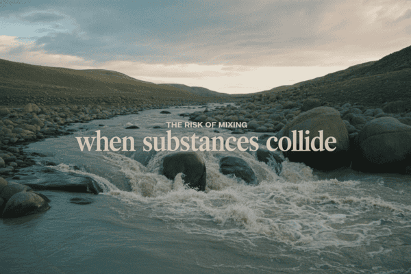 River with rocks and mountains, promoting detox and health assessment.